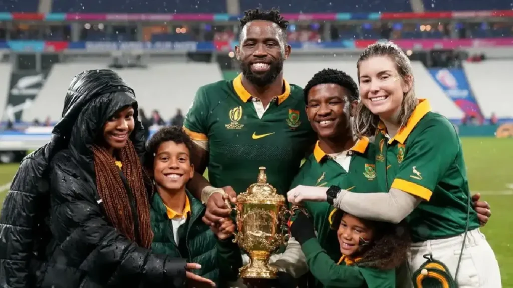 Siya Kolisi and Rachel at a public event