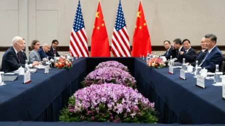 Xi Jinping and Joe Biden shaking hands at APEC summit