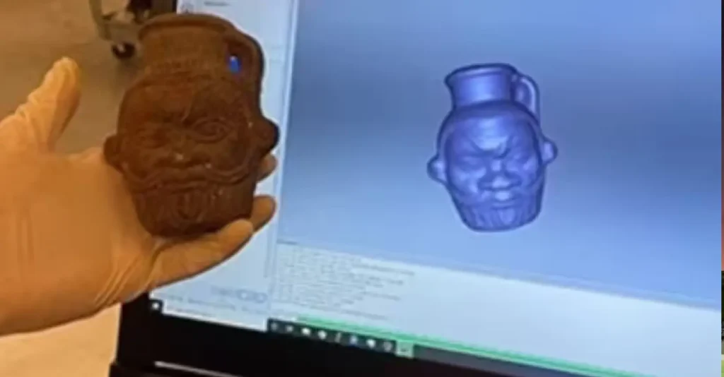 "Ancient Bes-shaped mug used in Egyptian rituals on display" "Chemical residue analysis of ancient Egyptian ritual mug" "Depiction of Bes, fertility deity, on a 2,000-year-old artifact" "Ingredients found in ancient Egyptian psychedelic concoction"