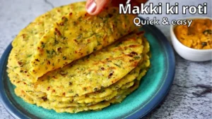 "Makki ki roti being prepared with aluminum foil and a plate."