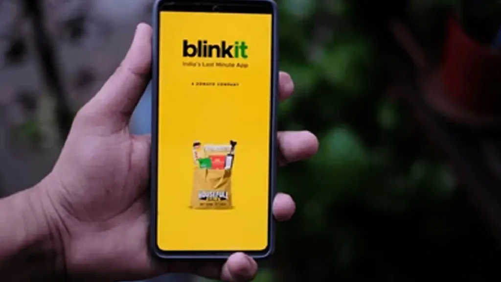 "Blinkit store at Maha Kumbh Mela serving pilgrims essentials" "Blinkit delivers daily essentials like milk and fruits at Kumbh" "Temporary Blinkit kiosk with pooja and utility items at Kumbh"