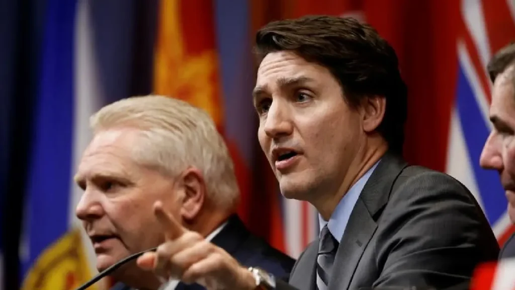 Justin Trudeau addressing a press conference on U.S. tariffs. Canadian cabinet retreat discussing U.S. trade policies. Trade war impact projections on Canada's economy.