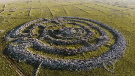 Rujm el-Hiri, Golan Heights monument, ancient basalt structure, tectonic shifts, ancient rock formations, historical research, satellite surveys, archaeological findings, mystery of Rujm el-Hiri