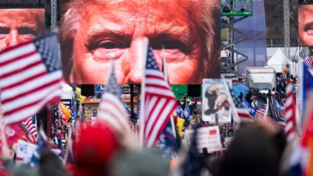 "Capitol riot scene with protesters and law enforcement" "Donald Trump addressing a crowd during a campaign rally" "Enrique Tarrio, former Proud Boys leader, in courtroom"